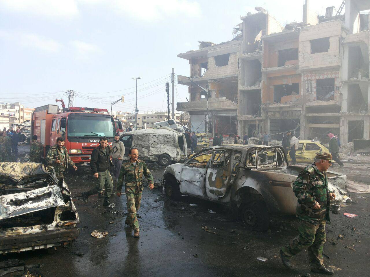 In Photos: The Grim Aftermath of Twin Car Bomb Blasts in the Syrian ...